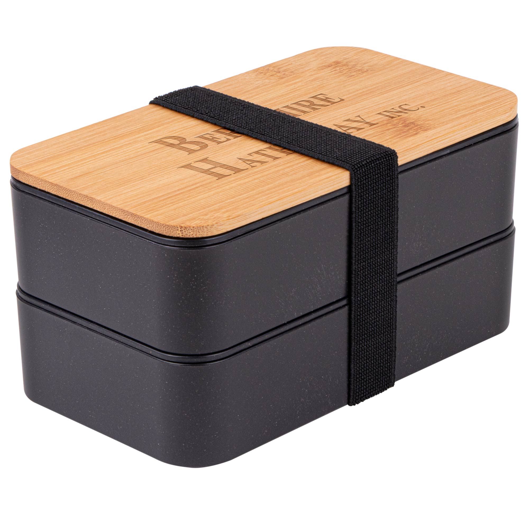 black boxes secured with a black rubber band, and bamboo lid